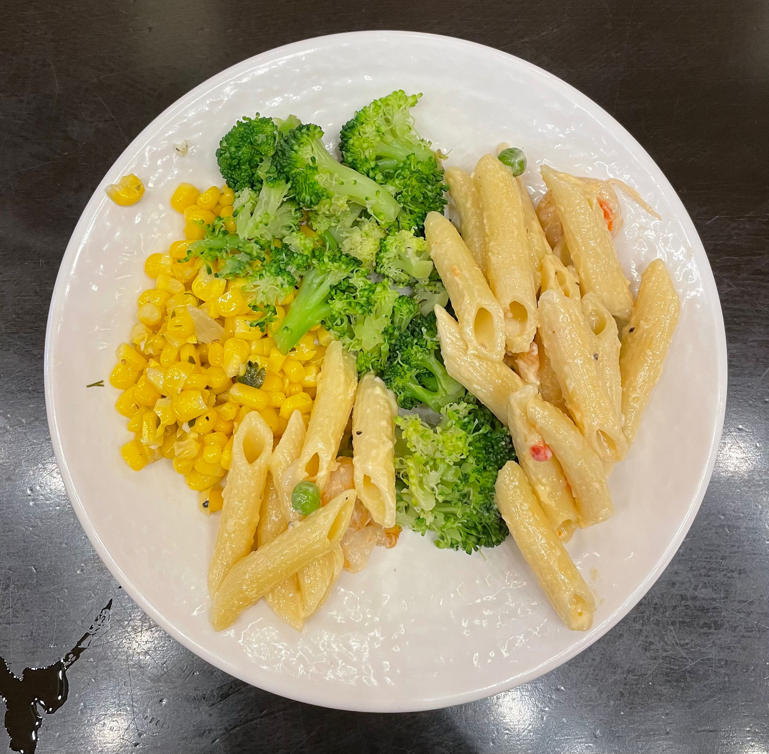 Shrimp pasta, broccoli, and corn