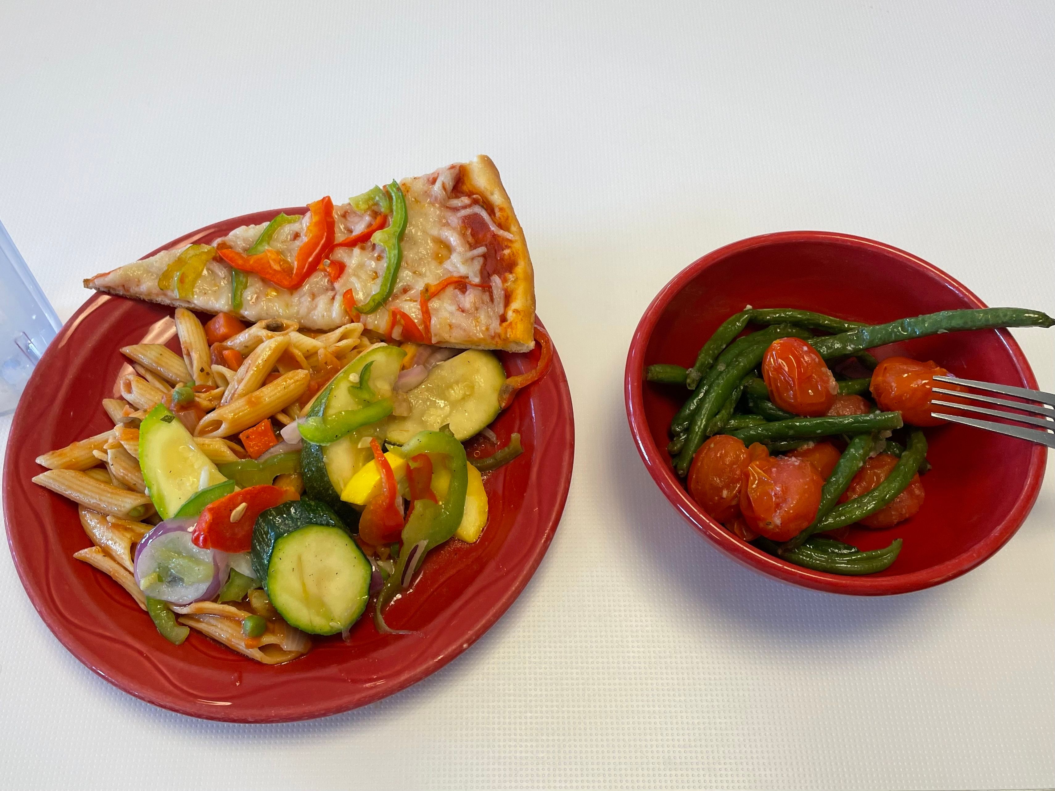 primavera pasta, vegetable stir fry, veggie pizza, string beans and cherry tomatoes