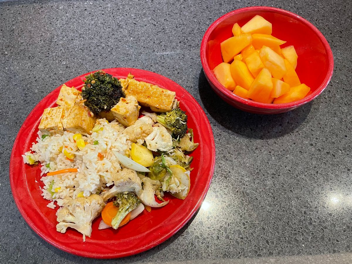 fried rice, tofu, stir-fried vegetables, cantaloupe
